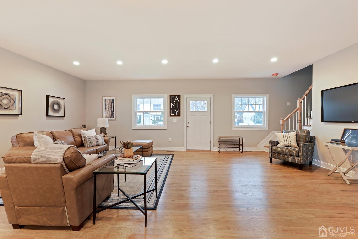 20 Sunset Drive Clark, NJ 07066 - Photo 9 of 32 a living room with furniture and a flat screen tv