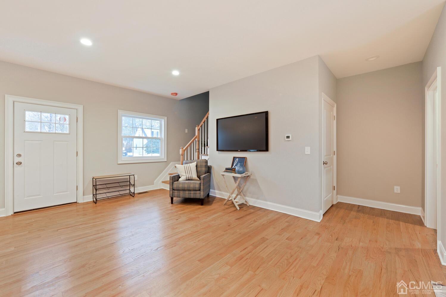 20 Sunset Drive Clark, NJ 07066 - Photo 10 of 32 a living room with furniture and a flat screen tv