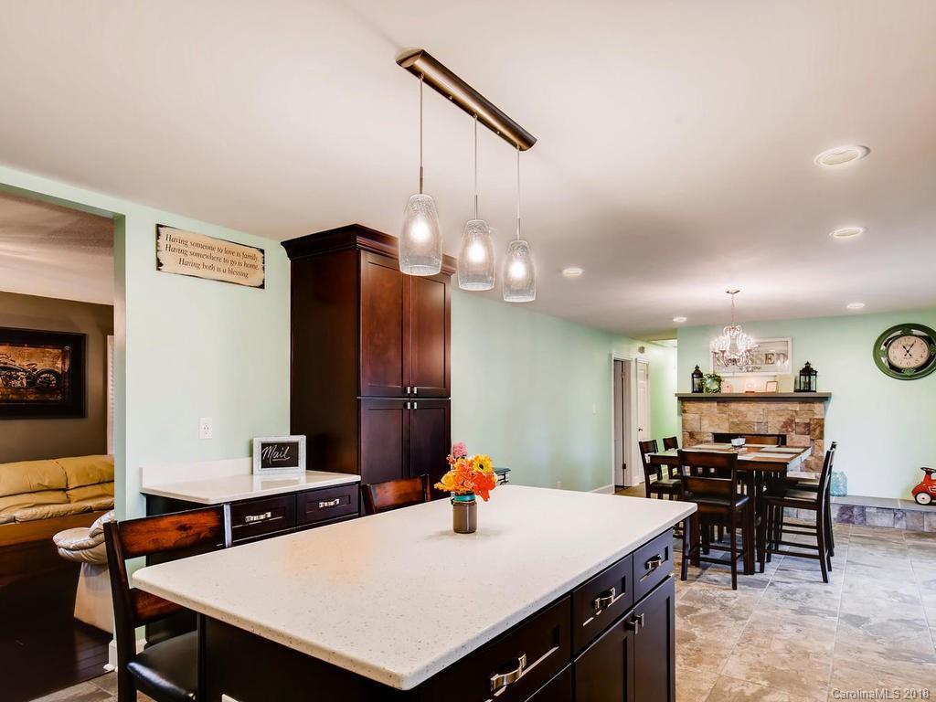 2411 Medlin Road Monroe, NC 28112 - Photo 11 of 27 a kitchen with a table and chairs in it