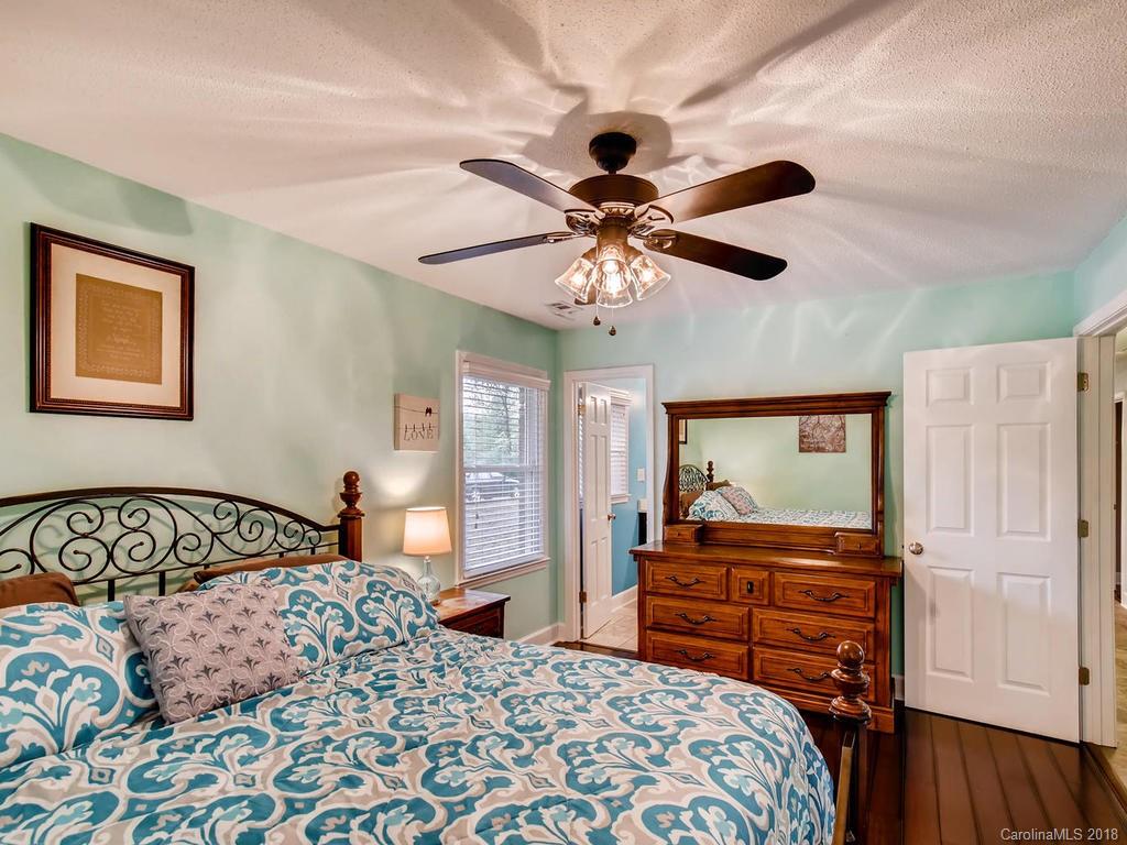 2411 Medlin Road Monroe, NC 28112 - Photo 17 of 27 a bedroom with a bed and a dresser