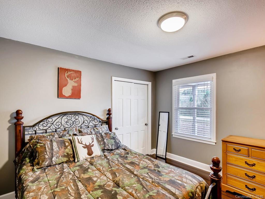 2411 Medlin Road Monroe, NC 28112 - Photo 20 of 27 a bedroom with a bed and a window