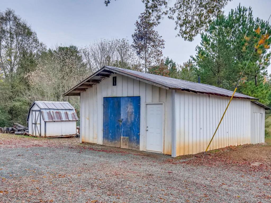 2411 Medlin Road Monroe, NC 28112 - Photo 27 of 27 a house with trees in the background