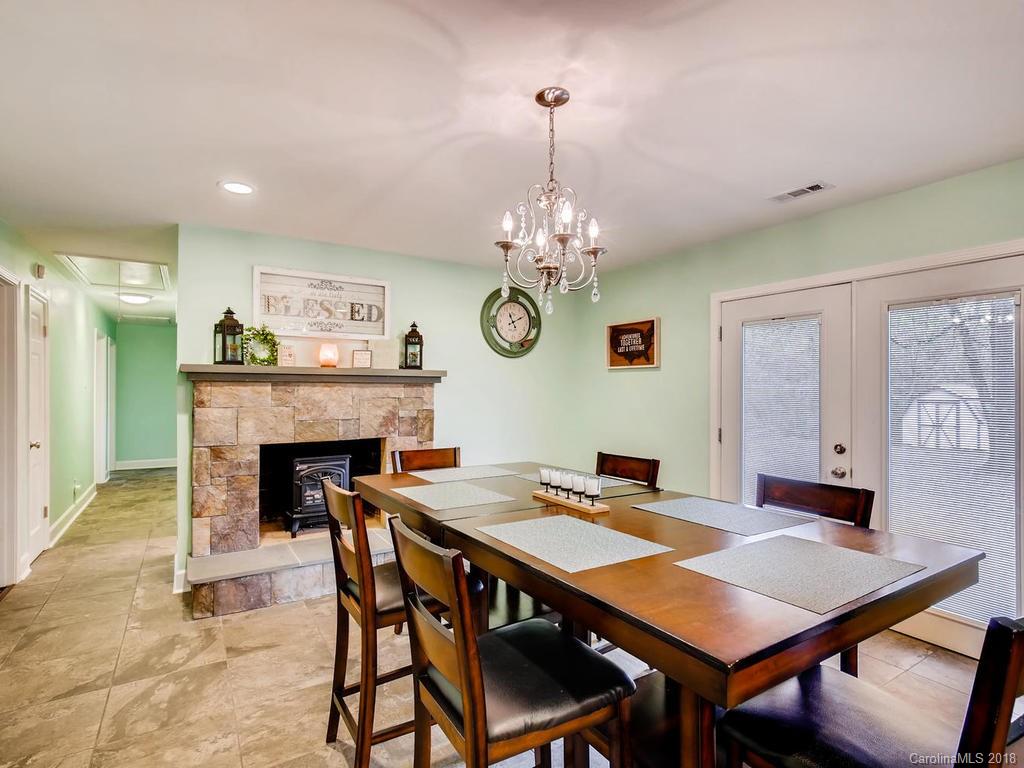 2411 Medlin Road Monroe, NC 28112 - Photo 9 of 27 a view of a dining room with furniture and chandelier