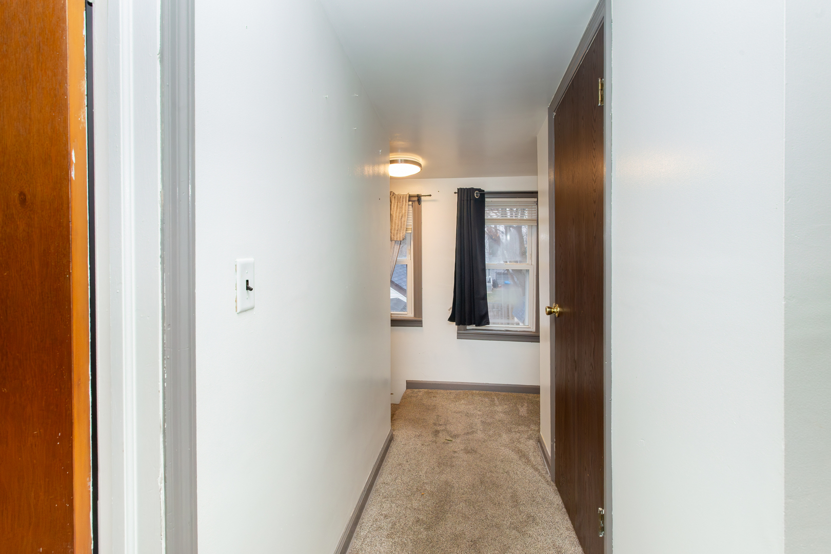 683 Columbia Avenue Elgin, IL 60120 - Photo 16 of 29 a view of a hallway with a white walls