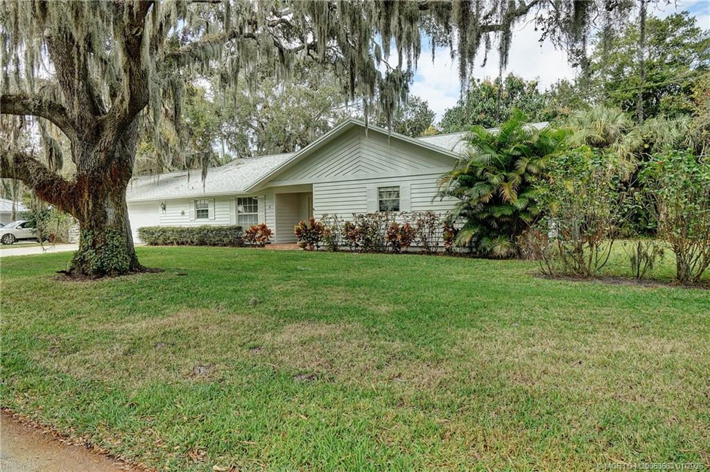 4 Miramar Road Sewall's Point, FL 34996 - Photo 2 of 31 a front view of house with yard and green space