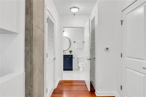 a bathroom with a shower and a mirror