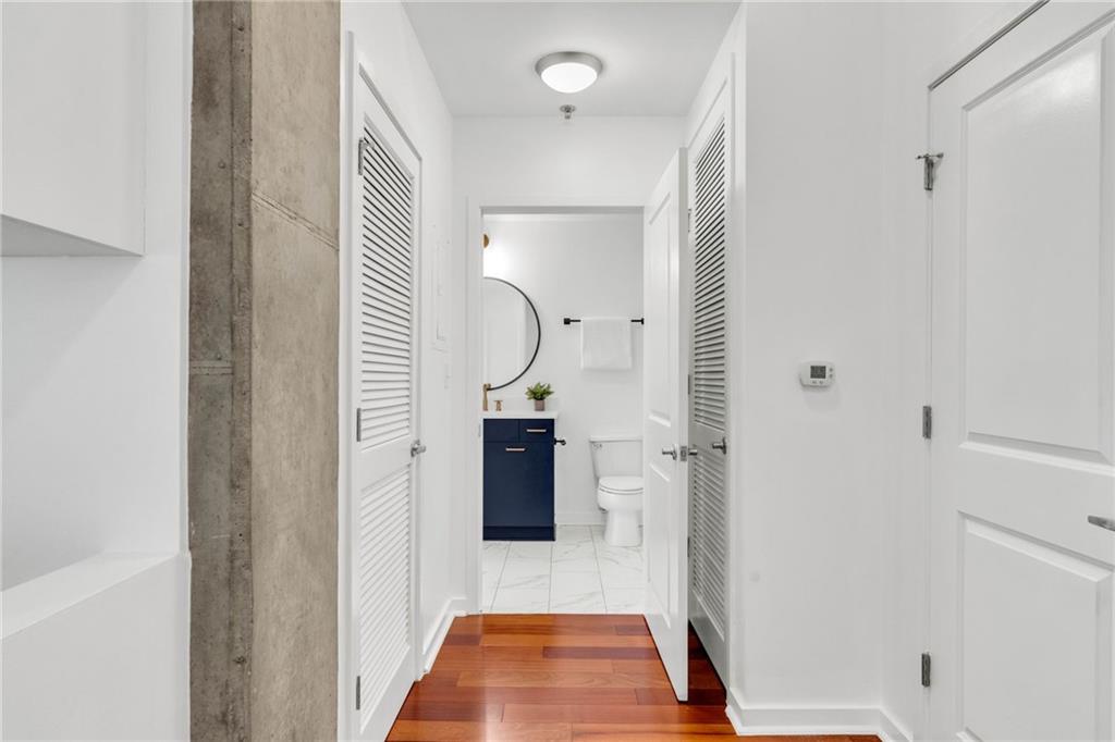 3324 Peachtree Road Northeast, Unit 1813 Atlanta, GA 30326 - Photo 17 of 34 a bathroom with a shower and a mirror