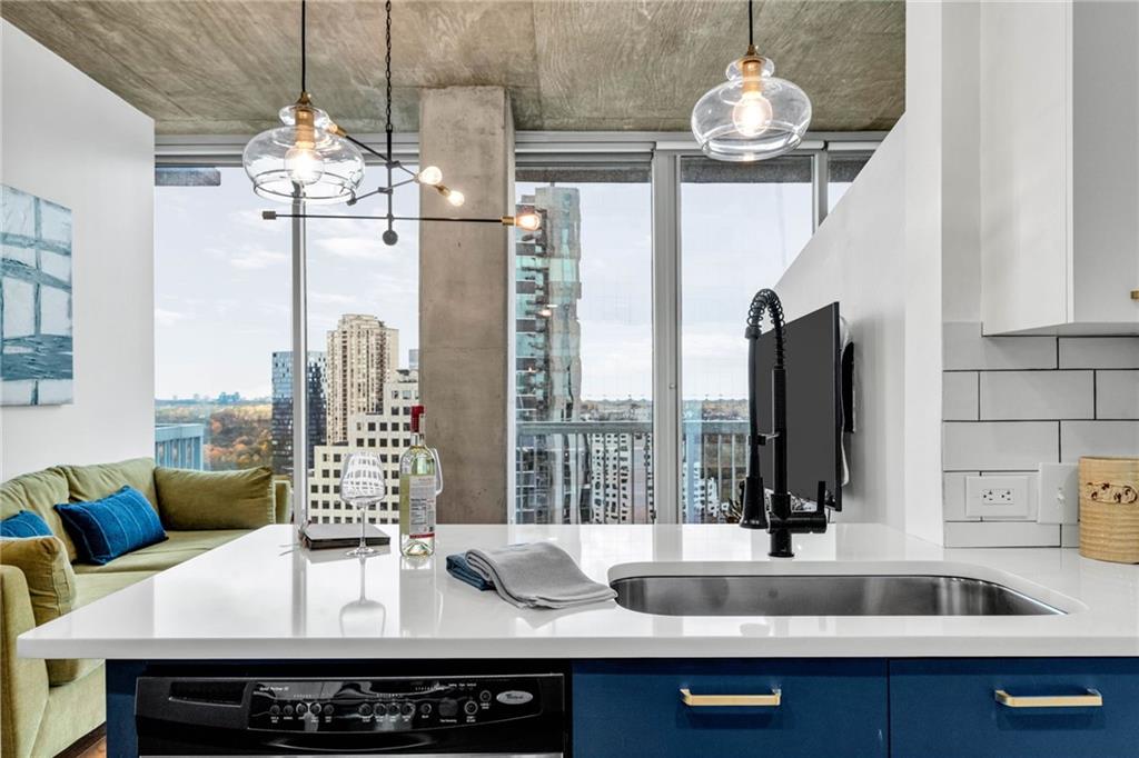 3324 Peachtree Road Northeast, Unit 1813 Atlanta, GA 30326 - Photo 2 of 34 a view of a dining room with furniture wooden floor and chandelier