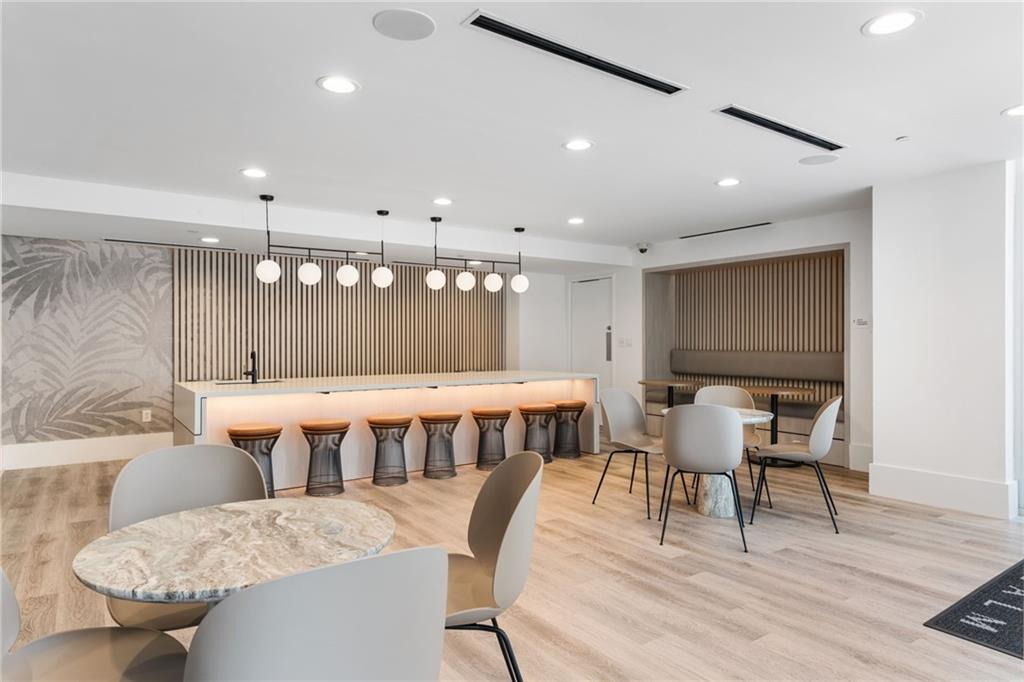 3324 Peachtree Road Northeast, Unit 1813 Atlanta, GA 30326 - Photo 29 of 34 a dining room with a table and chairs