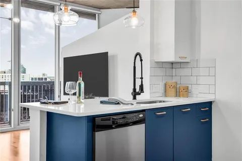 a bathroom with a sink double vanity and a mirror