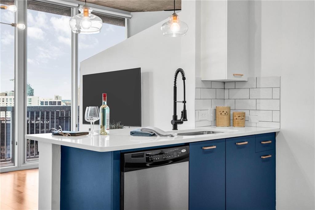 3324 Peachtree Road Northeast, Unit 1813 Atlanta, GA 30326 - Photo 3 of 34 a bathroom with a sink double vanity and a mirror