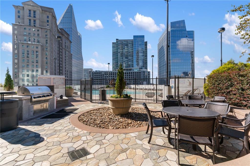 3324 Peachtree Road Northeast, Unit 1813 Atlanta, GA 30326 - Photo 31 of 34 a view of a dining room with furniture