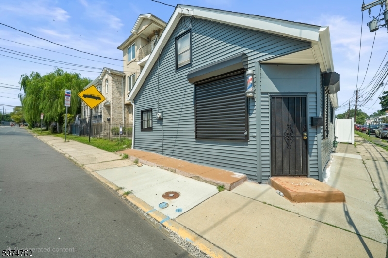 339 Hillside Avenue, Unit 2 Hillside, NJ 07205 - Photo 3 of 7 a view of a house with a patio
