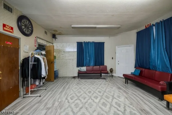 a bedroom with furniture and a closet