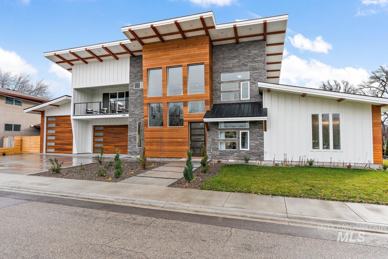 599 West Warren Street Boise, ID 83706 - Photo 2 of 41 Contemporary architectural design featuring diverse exterior finishes including wood paneling, vertical white siding, and stacked stone