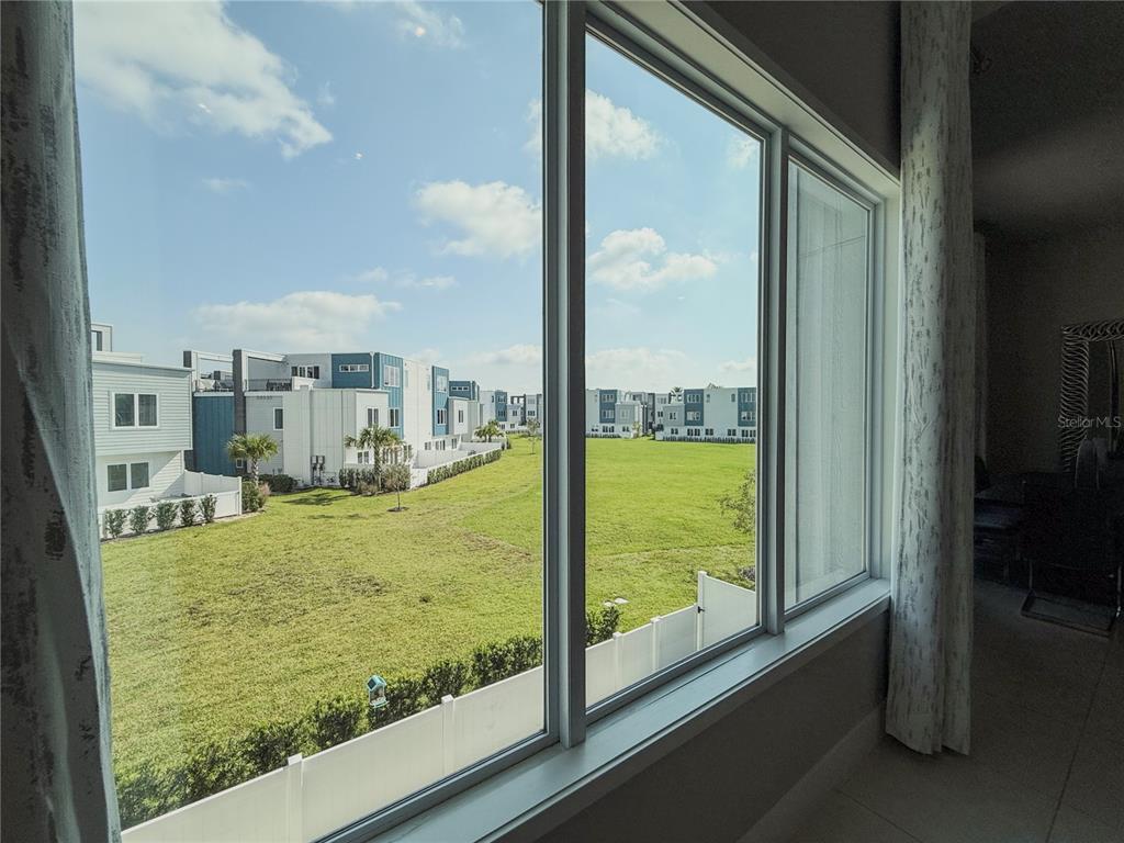 7770 Sandy Ridge Drive, Unit 231 Reunion, FL 34747 - Photo 13 of 25 a view of swimming pool from a window