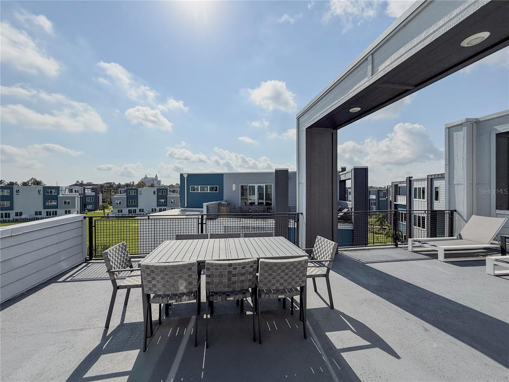 7770 Sandy Ridge Drive, Unit 231 Reunion, FL 34747 - Photo 24 of 25 a view of a terrace with furniture and a table