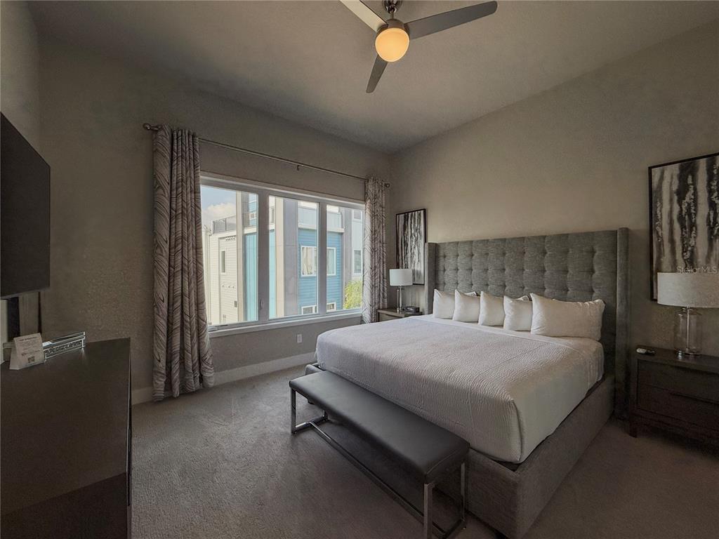 7770 Sandy Ridge Drive, Unit 231 Reunion, FL 34747 - Photo 7 of 25 a bedroom with a bed and window