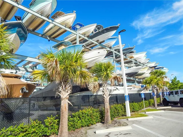 a view of a palm trees front of house