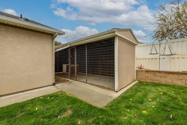a view of backyard with cabin