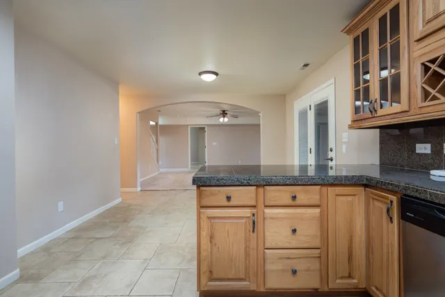 a view of a kitchen counter space with cabinets