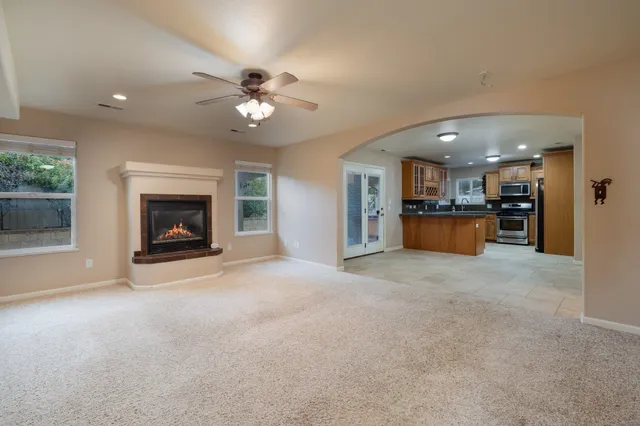 a view of a kitchen and a fireplace