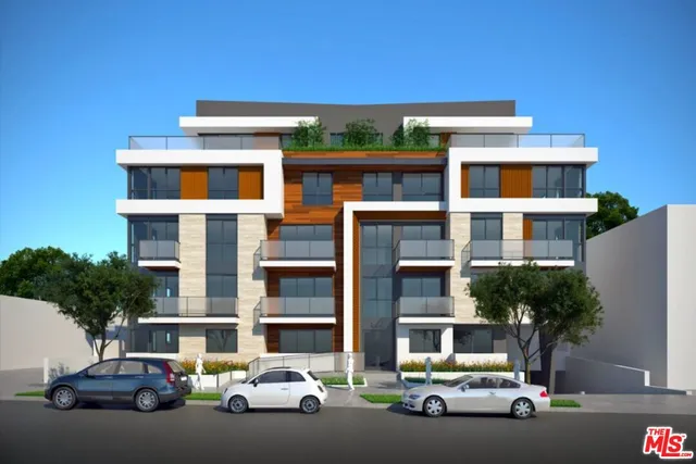 a front view of a building with parking space