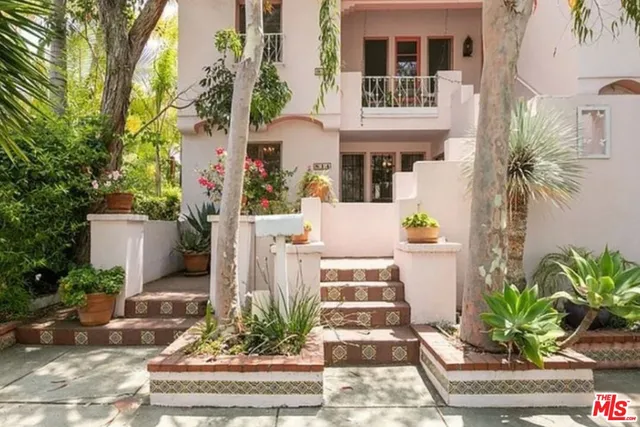a work room with furniture and a window