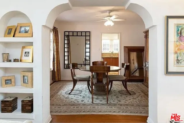 a living room with furniture fireplace and flat screen tv