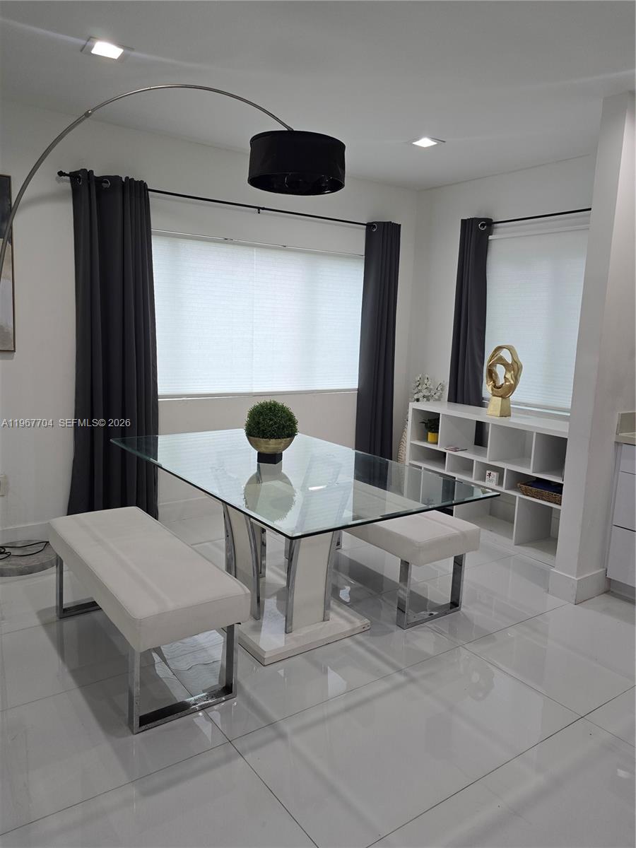 1453 Northwest 70th Street Miami, FL 33147 - Photo 16 of 19 a living room with furniture and a table