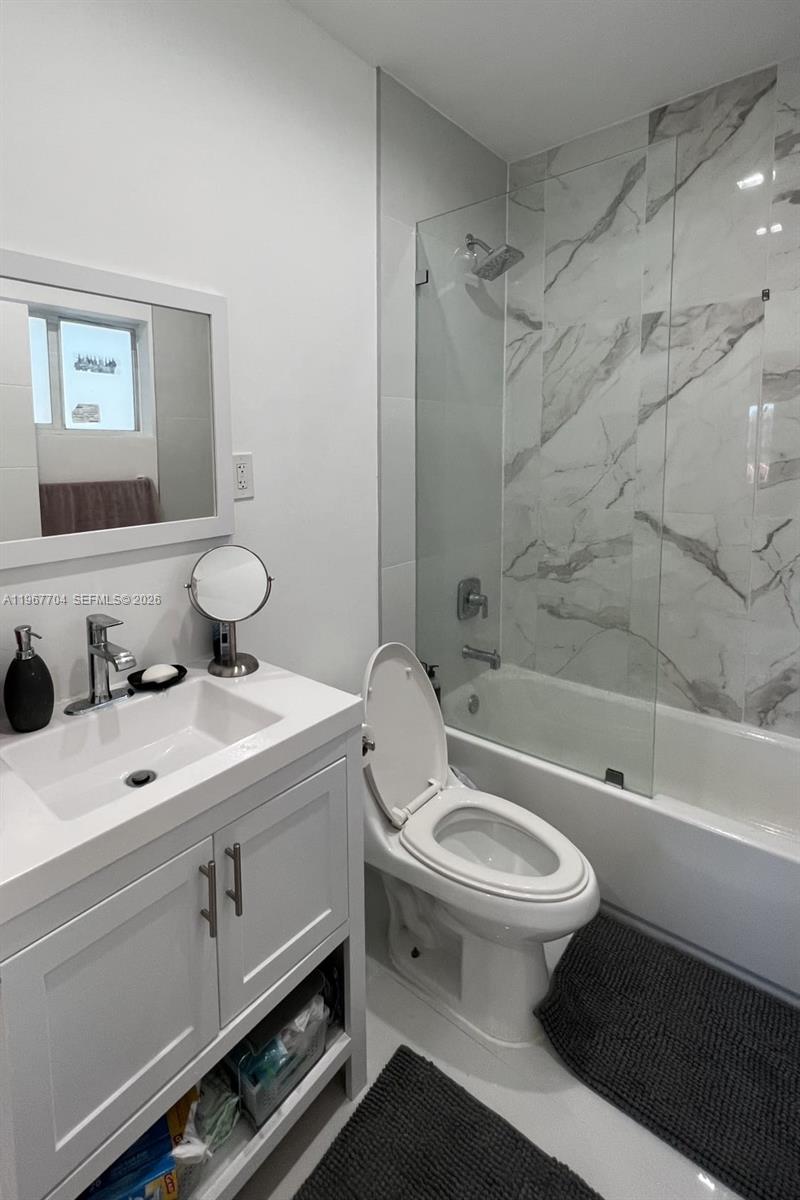 1453 Northwest 70th Street Miami, FL 33147 - Photo 7 of 19 a bathroom with a sink toilet and shower