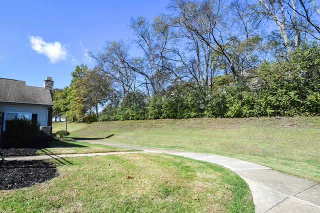 a view of a house with a fence