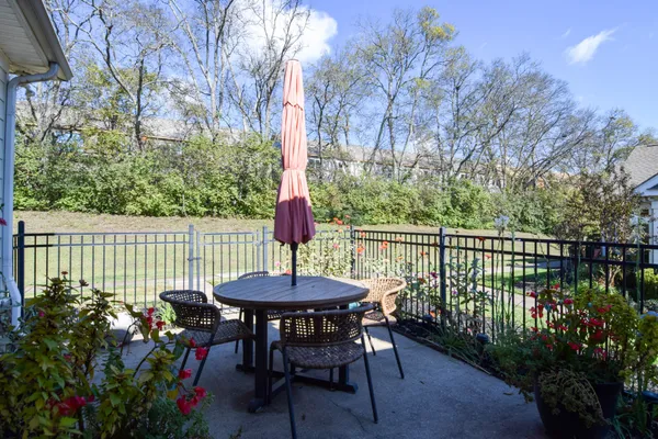 a view of a chairs and table in the patio