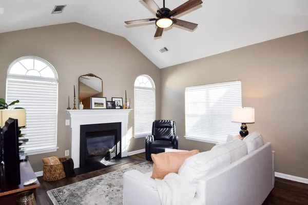 a living room with furniture and a flat screen tv