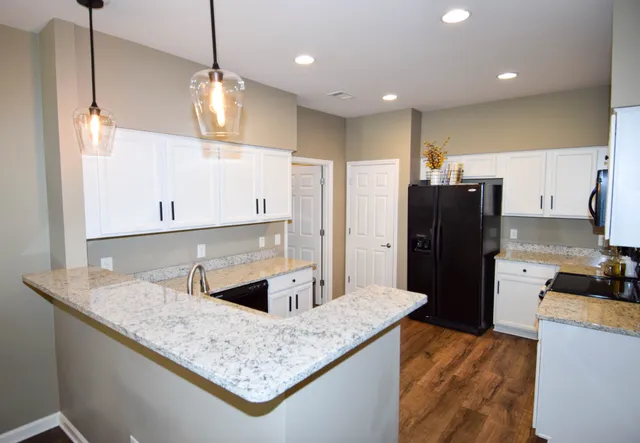 a kitchen with a sink stove and microwave