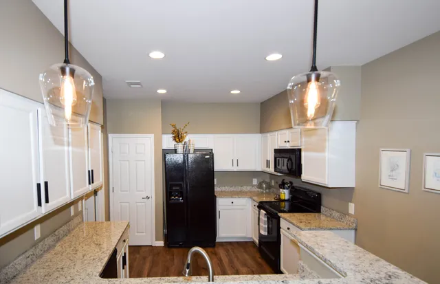 a bathroom with a sink a large mirror and vanity