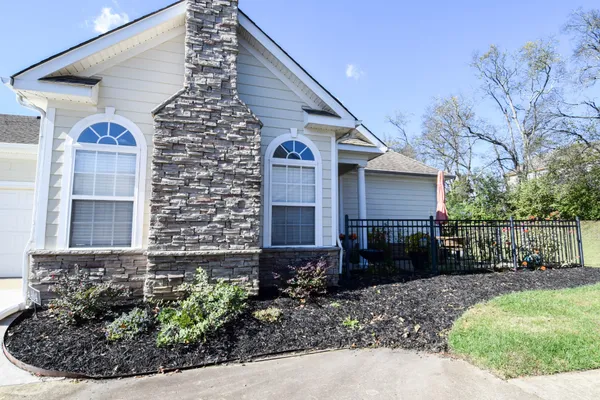 a front view of a house with garden
