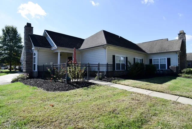 a front view of a house with garden