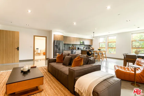 a living room with furniture and a table