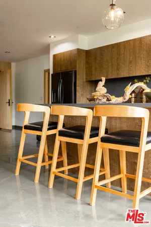a dinning table with chairs
