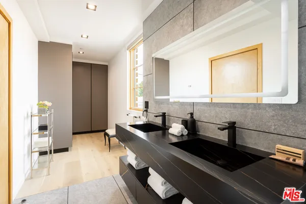 a kitchen with a sink and a refrigerator