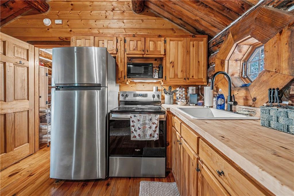 1790 Stanley Creek Road Cherry Log, GA 30522 - Photo 12 of 31 a kitchen with granite countertop a refrigerator and a sink