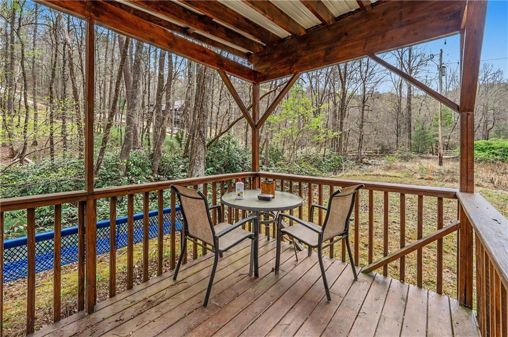 1790 Stanley Creek Road Cherry Log, GA 30522 - Photo 20 of 31 a view of a two chairs on the roof deck