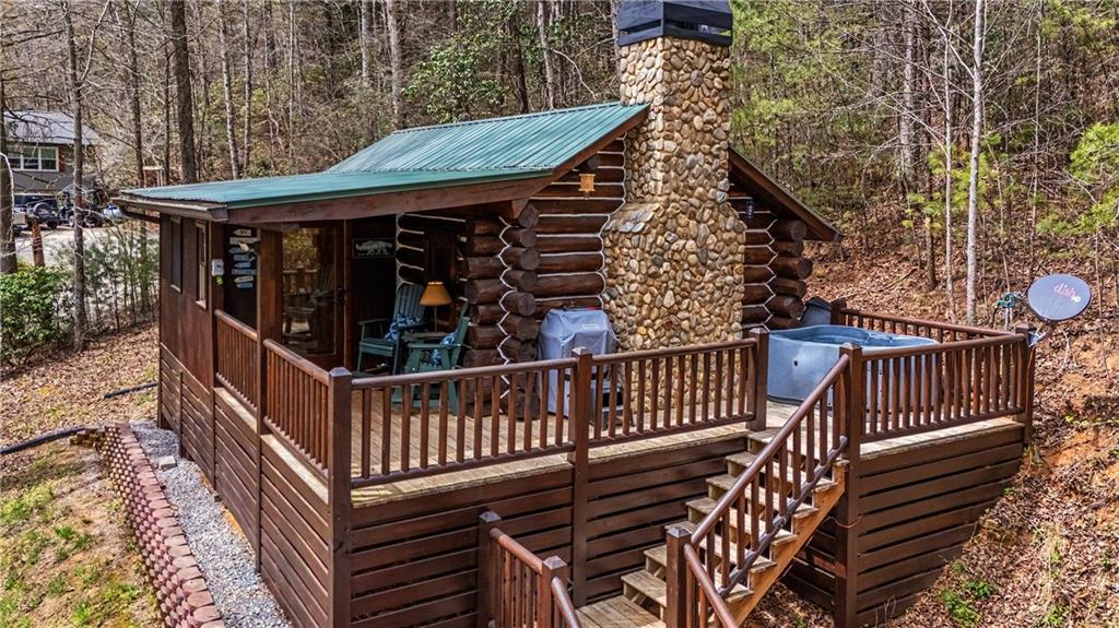 1790 Stanley Creek Road Cherry Log, GA 30522 - Photo 2 of 31 a view of a roof deck with wooden floor and fence
