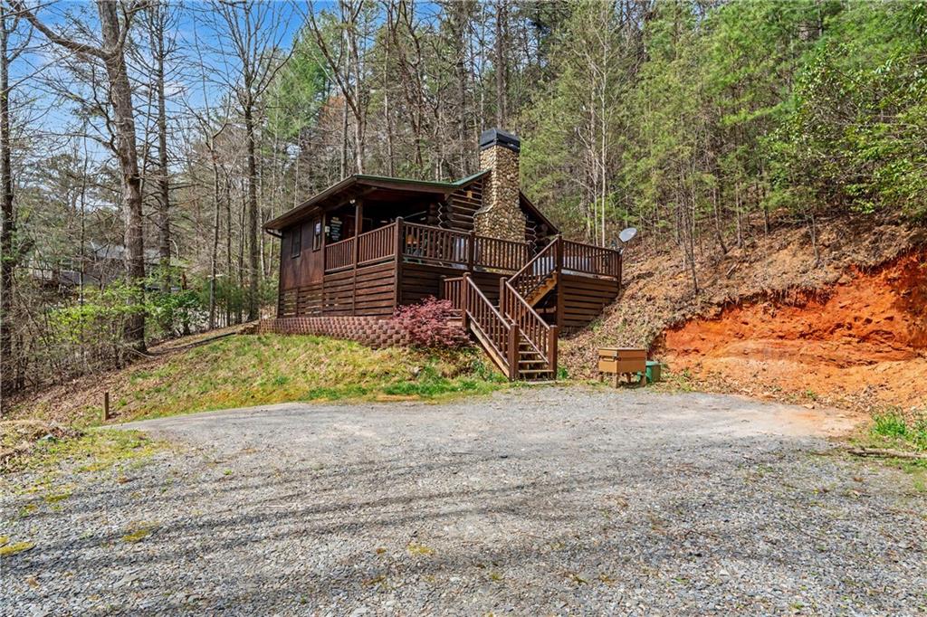 1790 Stanley Creek Road Cherry Log, GA 30522 - Photo 31 of 31 a view of a house with a yard and wooden fence