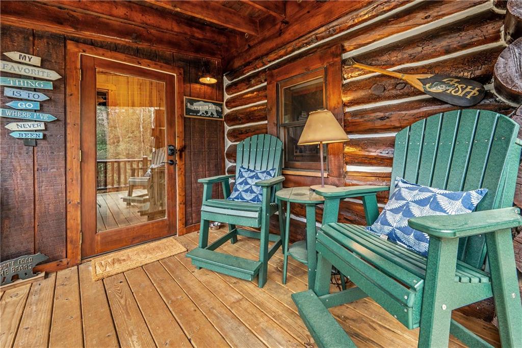 1790 Stanley Creek Road Cherry Log, GA 30522 - Photo 5 of 30 a patio with glass top table and chairs