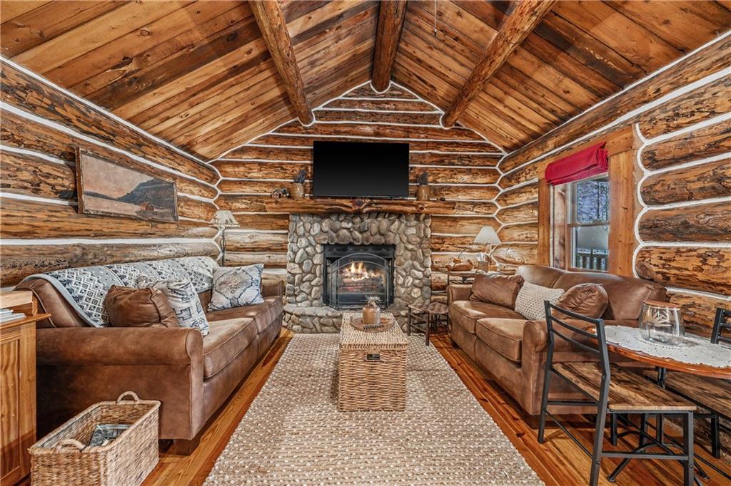 1790 Stanley Creek Road Cherry Log, GA 30522 - Photo 7 of 30 a living room with furniture and a fireplace