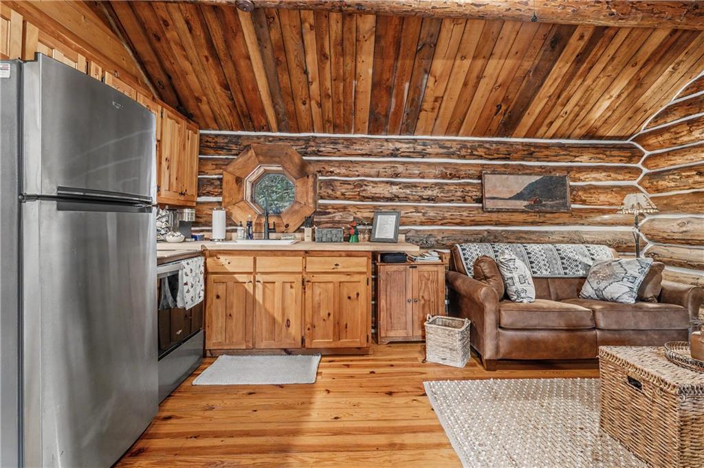 1790 Stanley Creek Road Cherry Log, GA 30522 - Photo 9 of 30 a kitchen with a refrigerator and a sink