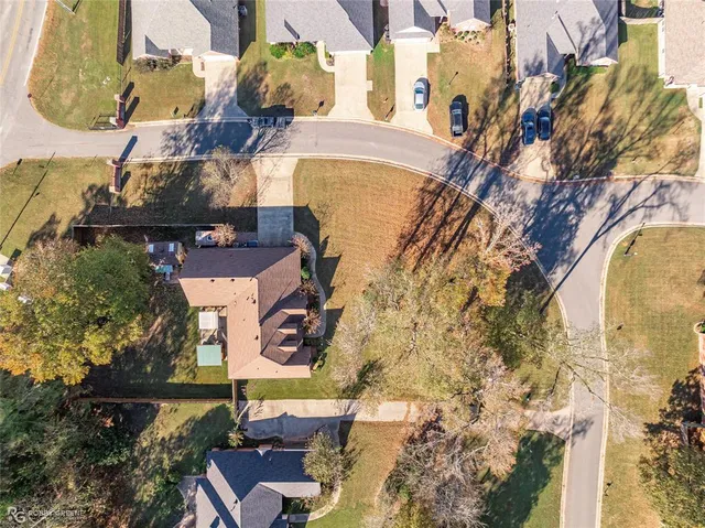 an aerial view of a house with swimming pool