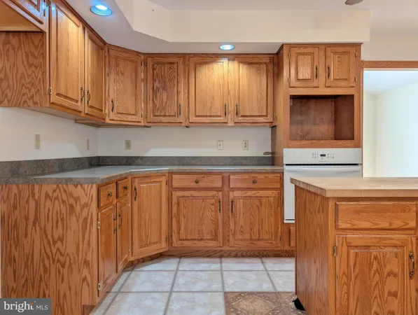 a view of hallway with livingroom and wooden floor